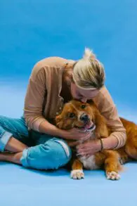 Woman hugging dog